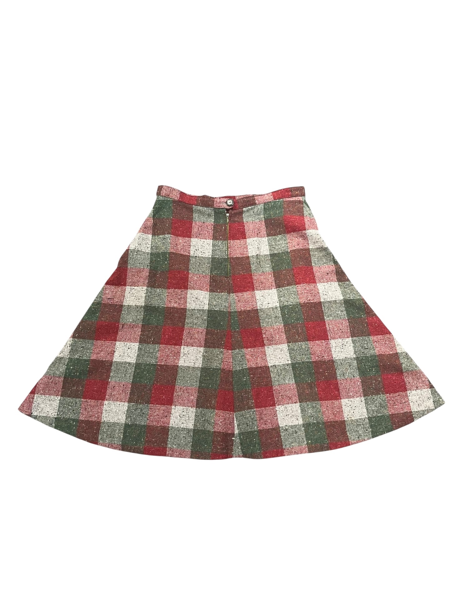 Plaid skirt with red, green, and white pattern on a white background
