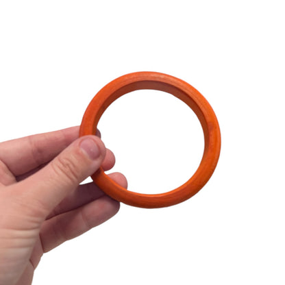 RIVETING ORANGE BANGLE